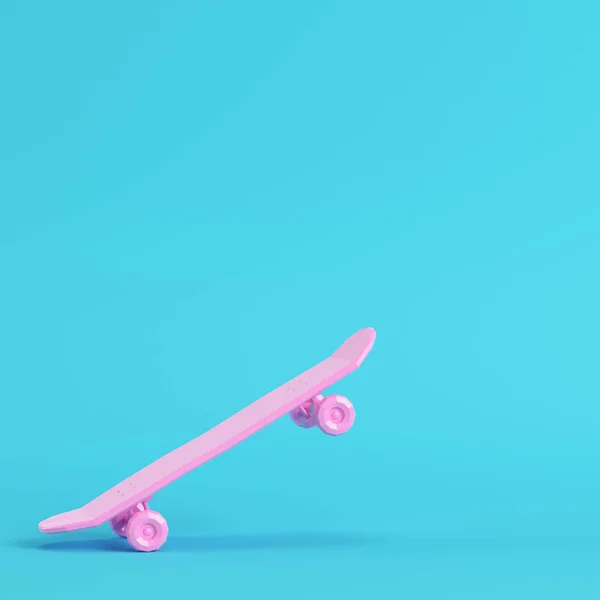 Pink low poly skateboard deck on bright blue background in pastel colors. Minimalism concept. 3d render