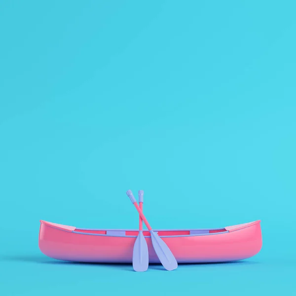 Pembe Kano kürekler pastel renklerde parlak mavi arka plan ile. Minimalizm kavramı. 3D render