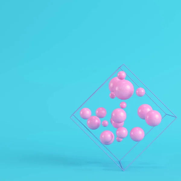 Abstract spheres in wire box on bright blue background in pastel