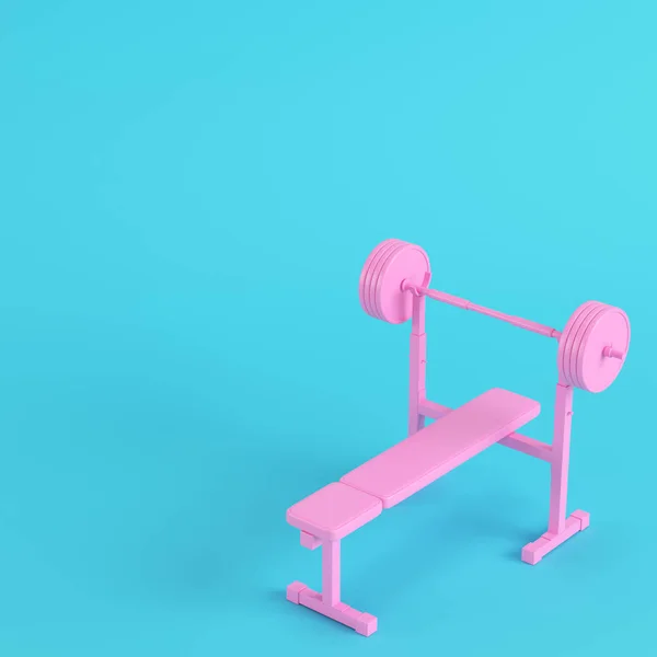 Pink barbell with bench with ball on bright blue background in p — Stock Photo, Image