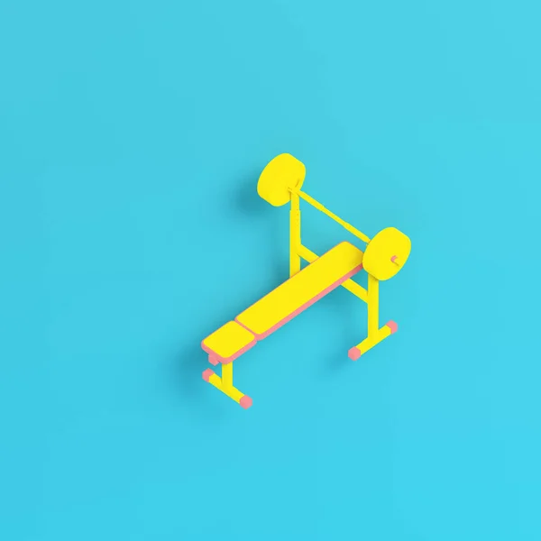 Barbell amarelo com bancada sobre fundo azul brilhante em pastel co — Fotografia de Stock