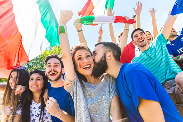 Italian Supporters Celebrating Stadium Flags Couple Kissing Crowd Fans Watching — Stock Photo, Image