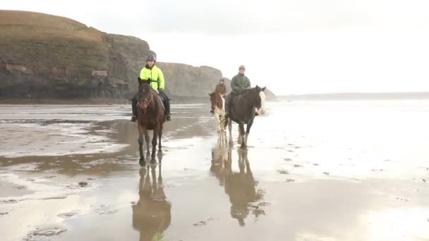 People Riding Horses Beach Passing Next Camera Three People Riding — Stock Video