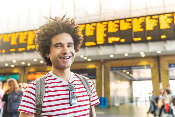 Happy man portrait at train station in London