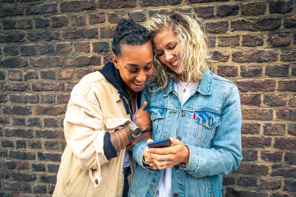 Happy Girlfriends Looking Smartphone Having Fun Multiracial Lesbian Couple Millennials — Stock fotografie