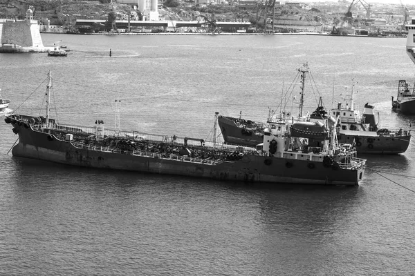 Tank ship designed for transporting liquefied natural fuels in the port of Malta. Black and white picture