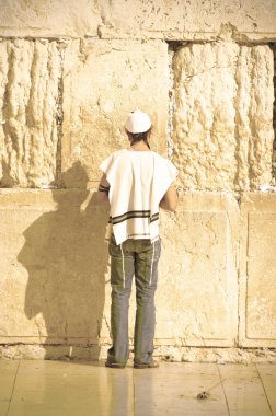 Praying Jew at the Western Wall of the Jerusalem Temple in Israel clipart