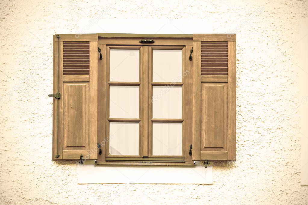 Typical window of a house in a small town in Austria. Home in the Austrian city of St Wolfgang in a rainy day. Retro style