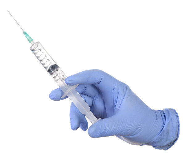 Hand in medical blue glove holding syringe. Isolated on white. 