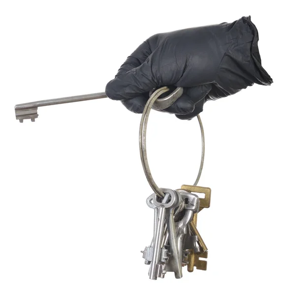 Hand Einen Schwarzen Handschuh Mit Alten Schlüsseln Auf Weißem Hintergrund — Stockfoto