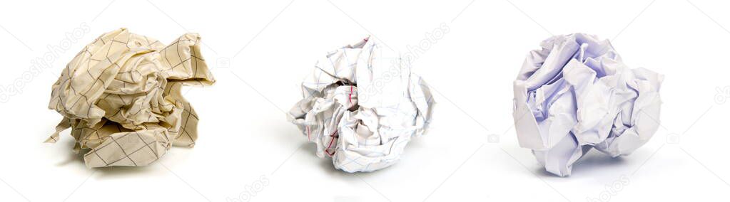 several sheets of crumpled discarded paper isolated on a white background