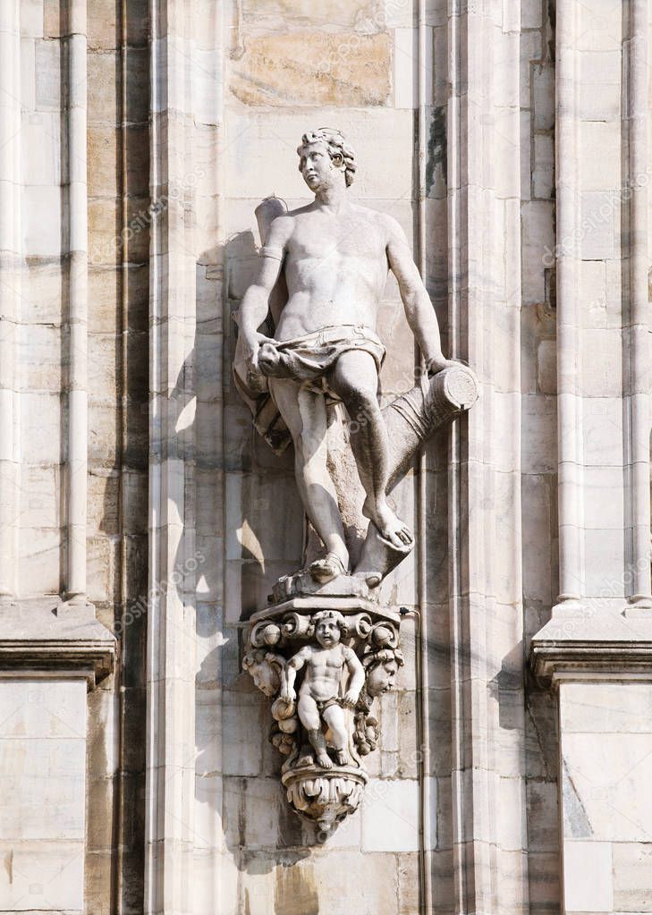 Statue on the wall of Milan cathedral