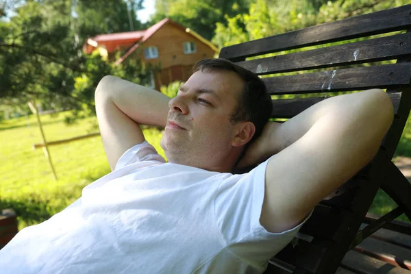 Man Lying Wooden Bench Backyard — Stock Photo, Image