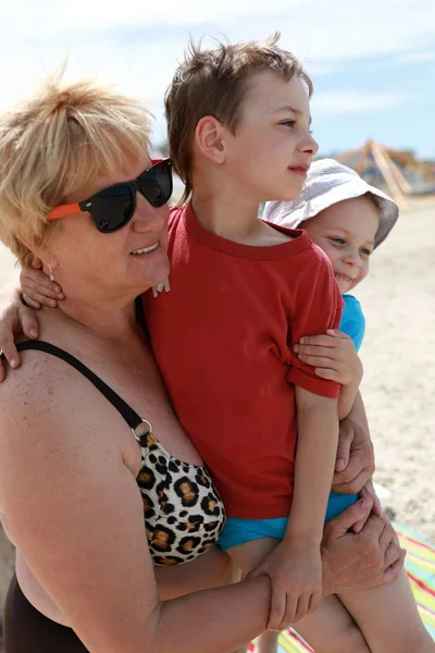 Grandmother Hugging Her Grandsons Beach — Stock Photo, Image