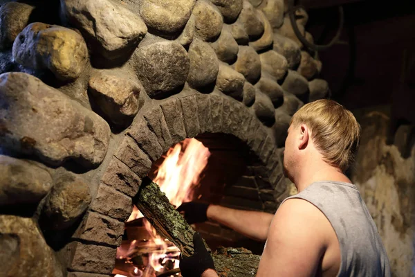 Person Kindles Fire Fireplace Backyard — Stock Photo, Image