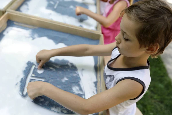 Boy Paints Sand White Table — Stock Photo, Image