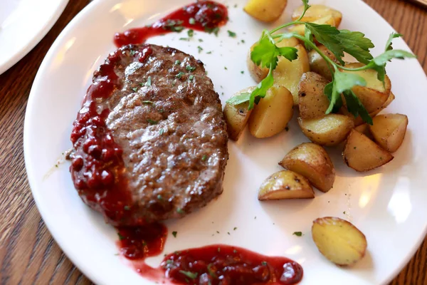 Venison Cutlet with baked potatoes — Stock Photo, Image