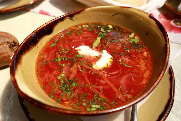 Bowl of borsch with sour cream — Stock Photo, Image