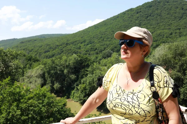 Senior woman on observation deck — Stock Photo, Image