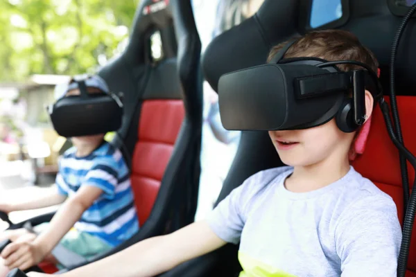 Children play virtual reality simulator