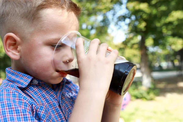 Boy drinking kvass — Stock Photo, Image