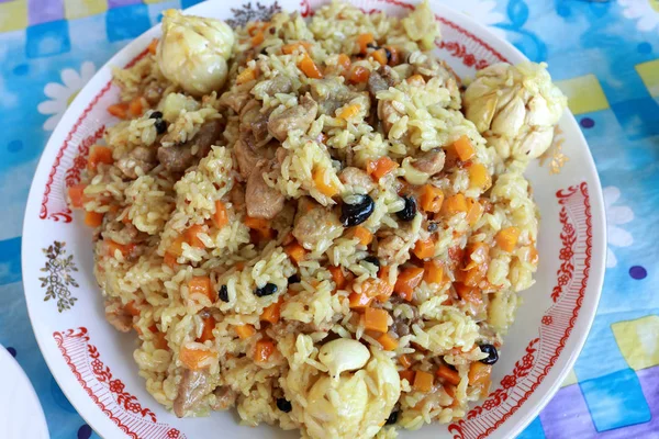 Plate with pilaf on table — Stock Photo, Image