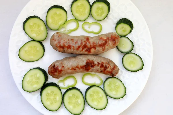 Fried Sausages Slices Fresh Cucumbers Plate — Stock Photo, Image