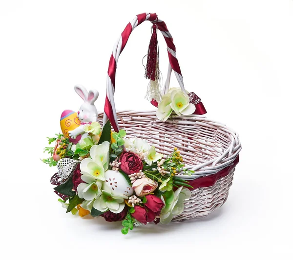 Festive basket with a flower arrangement on white background — Stock Photo, Image