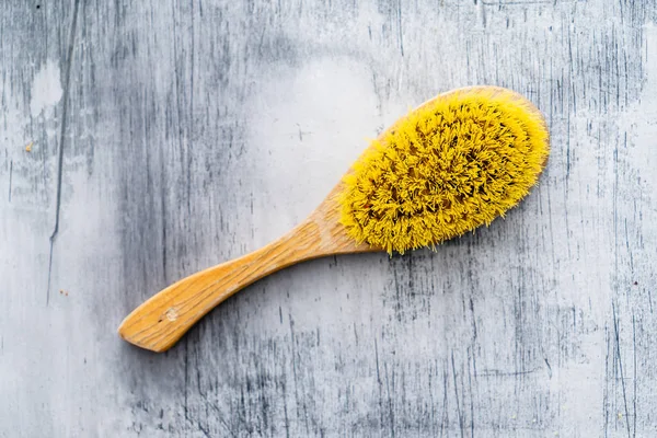 body brush on wooden background