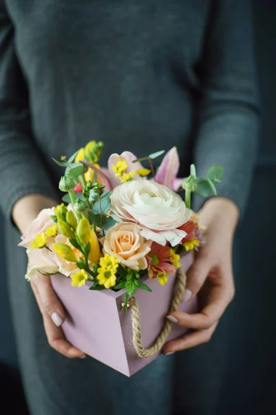 nice bouquet in the hands of woman