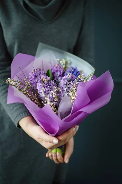 nice bouquet in the hands of woman