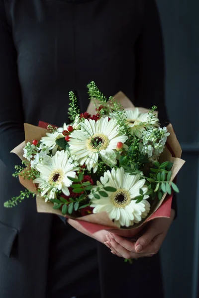 nice bouquet in the hands of woman