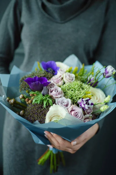 nice bouquet in the hands of woman