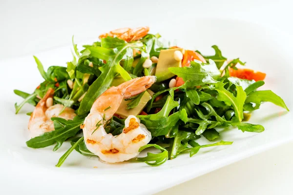 salad with shrimps, rocket salad and cherry tomatoes