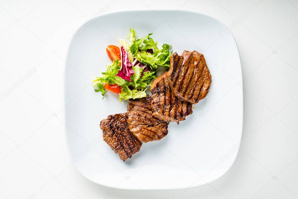 grilled meat : beef ( lamb ) garnished with salad