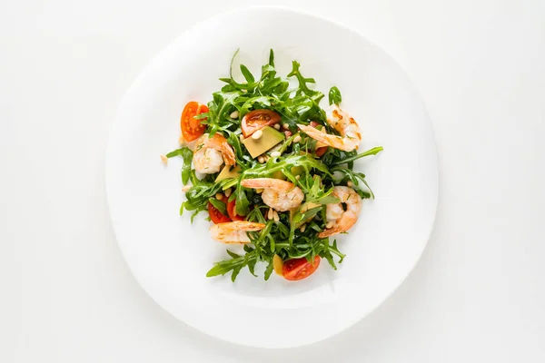 salad with shrimps, rocket salad and cherry tomatoes