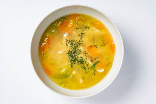 fresh nutrient vegetable soup in the white bowl