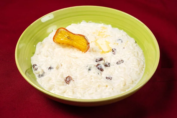 rice pudding with raisins and butter, close up