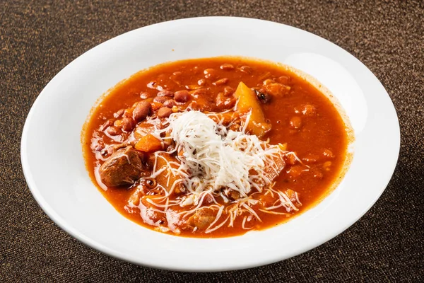 winter soup with beef and beans, close up