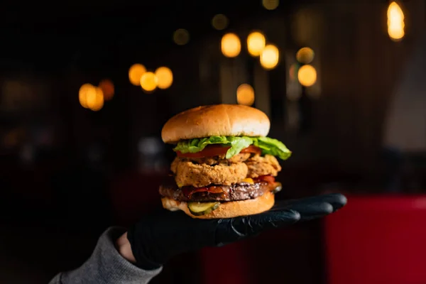 woman  eating burger in the restaurant