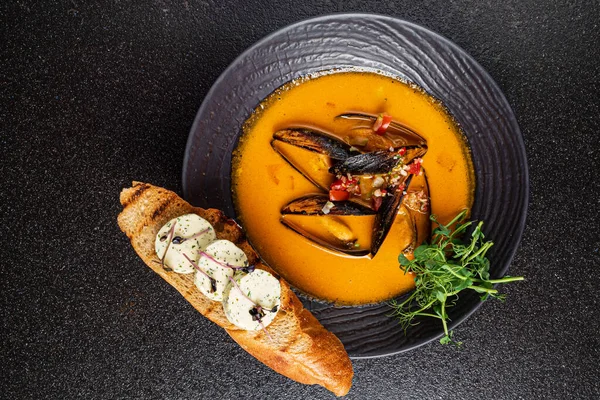 Seafood soup with toast on the black background — Stock Image Seafood Soup Toast Black Background Stock Photo