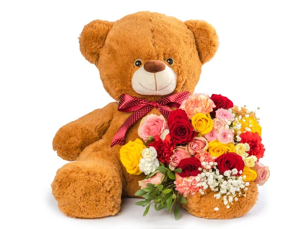 Teddy Bear and flowers isolated on white
