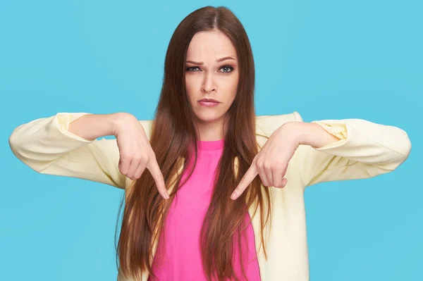 Serious Beautiful Woman Pointing Both Hands Isolated Bright Blue Background — Stock Photo, Image