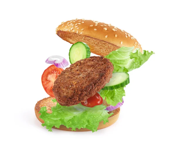 Köstliche Burger Mit Fliegenden Zutaten Isoliert Auf Weißem Hintergrund — Stockfoto