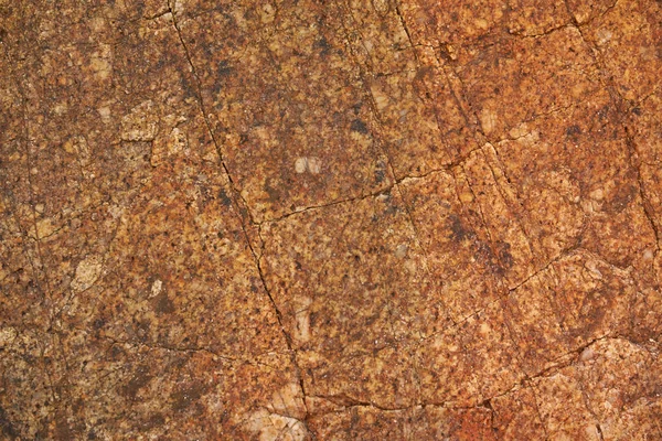 ひびの入った古い茶色の花崗岩石のテクスチャ — ストック写真