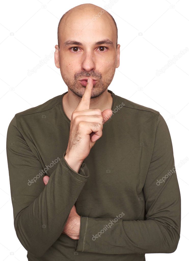 middle aged bald man making shh gesture. Isolated on white