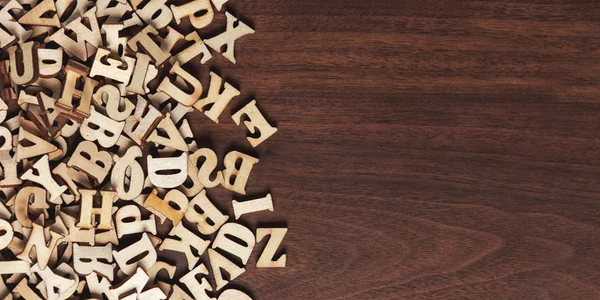 Heap of wooden letters on a wood background — Stock Photo, Image