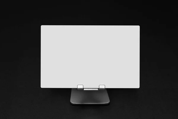 Blank white paper sheet on a stand with copy space — Stock Photo, Image