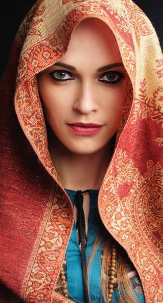 Beautiful woman is wearing colorful headscarf