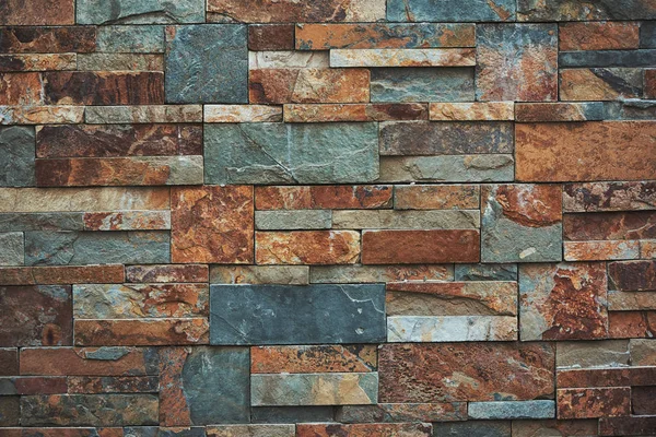 Stedelijke stenen muur textuur achtergrond. Teal en oranje kleuren. — Stockfoto